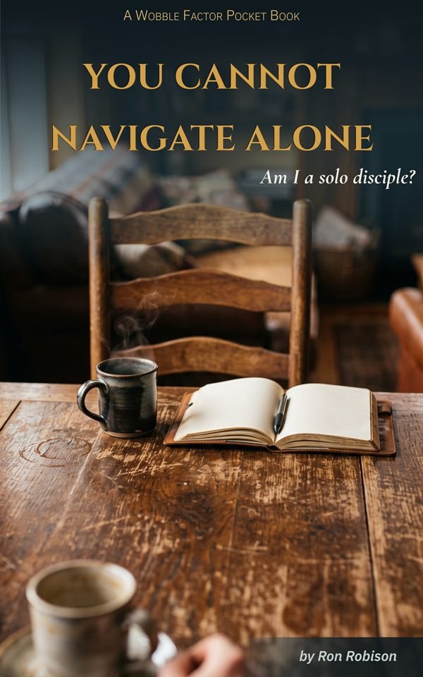 Cover of You Cannot Navigate Alone by Ron Robison: a worn wooden table with a steaming mug, an open journal and an empty chair pulled up to it. A Wobble Factor Pocket Book.
